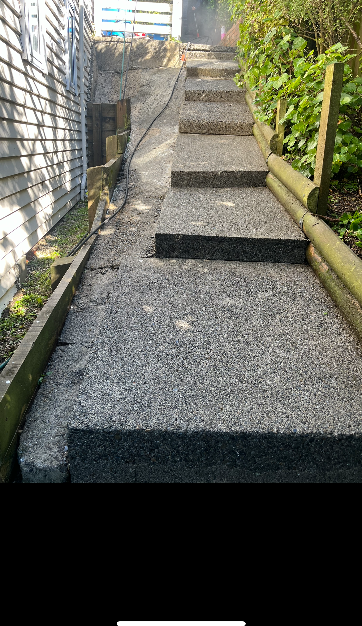 Clean concrete path and steps after pressure washing